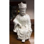 A late 19th / early 20th century Chinese blanc de chine figure of Guanyin, approx 66cm high