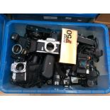 Collection of 20th century Nikon automatic cameras including a collection of mixed lenses