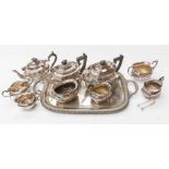 Two Georgian style three piece plated tea sets and another tea set, similar, stamped together with a