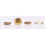 A collection of gold rings to include a Victorian diamond and ruby 18ct gold ring, size O, an 18ct