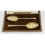 A matched pair of George III berry spoons, the bowls later chased and handles with Onslow shaped