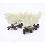 A pair of Chinese carved hardstone figures of Chickens, on carved stands (2)