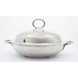 A late 19th Century circular silver plated tureen and cover with removable divider, stamped to