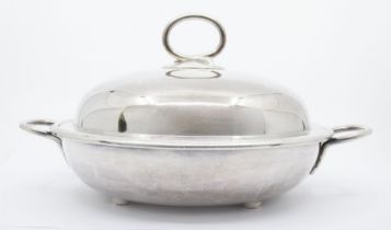 A late 19th Century circular silver plated tureen and cover with removable divider, stamped to