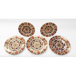 Three Royal Crown Derby 1128 Imari first quality dinner plates, along with two medium