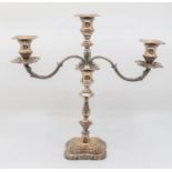A Modern silver three light candelabra, detachable drip pans and branch, with spool shaped sconce