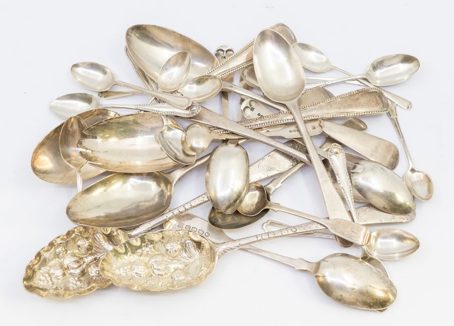 A collection of 19th & 20th Century silver spoons to include: two George III berry spoons; a pair of