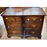 Pair of oak reproduction Georgian bedside cabinets, both with three drawers, brass swing handles and