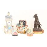 Snowglobes: A collection of four assorted snowglobes to include: two Disney examples and two others,