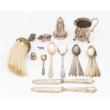 A collection of silver and white metal items to include: an Edwardian novelty small pig pin cushion,