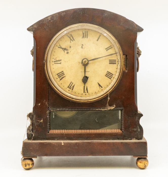 A London single fusee mantle clock in  flame mahogany case, on ball feet, Roman numerals, lions head