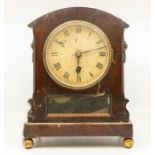 A London single fusee mantle clock in  flame mahogany case, on ball feet, Roman numerals, lions head