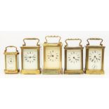 Five brass mantle clocks, early to mid 20th Century, all Roman numerals