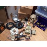 Collection of smoking ephemera including large zippos lighters pipes along with resign skull