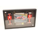 Formula 1: A cased Michael Schumacher montage, containing two model Formula 1 vehicles and a