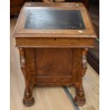 A Victorian mahogany Davenport with side drawers and dummy drawers, lift-up writing slope with