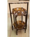 A 1950's cake/sandwich stand with turned frame, with two treacle glass plates made by David