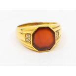 A gents carnelian and diamond set ring, comprising a hexagonal flat cut carnelian, ridged