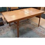 Teak 1960s pull out dining table along with six matching kidney back chairs