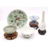 A collection of Chinese pots to include Celadon bowl, hog fired vase, plate, rice bowl and stands