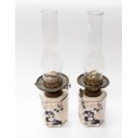 A pair of early to mid 20th Century Masons table oil lamps