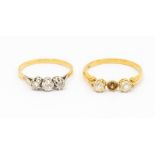 Two diamond set 18ct gold rings, including a three stone ring, platinum set with three old cut