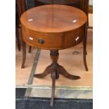 A reproduction mahogany drum table