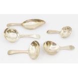A group of five George III silver caddy spoons, all hallmarked to include:  1. plain Old English