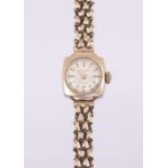 A ladies vintage 9ct gold Accurist wristwatch, round silvered dial applied gilt baton markers within