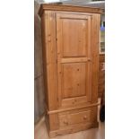 A collection of antique pine bedroom furniture to include: two chests of drawers, wardrobe, two