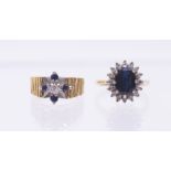 Two sapphire and diamond set 18ct gold rings to include a cluster set to the centre with a claw