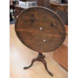 An 18th Century plank-top tilt top table in oak