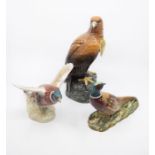Beswick golden eagle decanter containing whisky and two Beswick pheasants, 849 and 1226. Repairs