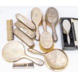 A collection of silver mounted dressing table items including hand and hair brushes, comb, mirror,