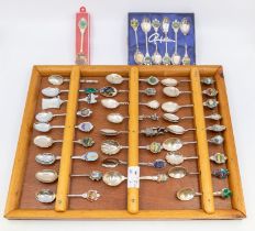 A collection of commemorative of plated teaspoons with wooden display case (1)