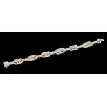 An Art Deco style diamond and 18ct white gold bracelet comprising geometric links with three rub