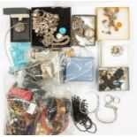 A collection of costume jewellery to include silver charm bracelets, silver turquoise handbag charm,
