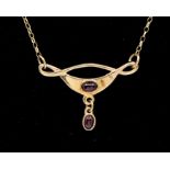 A modern Arts & Crafts style 9ct gold pendant comprising curved forms set to the centre with an oval