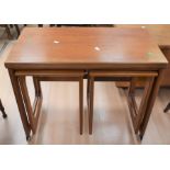 A 1970s teak nest of tables along with a 1970s coffee table/cupboard and drawer unit (2)