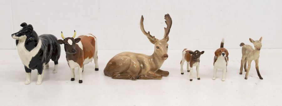 A collection of Beswick animals including stag, fawn, dogs and cattle (6)