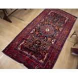 Turkish red ground rug with floral detail 340cm x 162cm along with another Turkish red ground rung