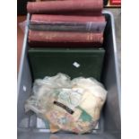 Box containing a selection of old albums and accumulation of stamps off paper, early Commonwealth,