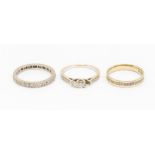 A collection of two diamond set 18ct white gold rings, including a half eternity ring set with small