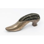 A late Victorian large novelty silver hat pin cushion, cast in the form of a shoe, plain body, the