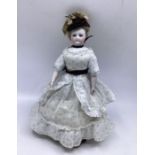 French 19th C Fine Poupee De Mode doll 29cm with original gown  wig hat, cork pate and heeled tan