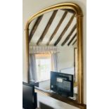 A 20th century gilt arch shaped mirror. ***Offsite Location***