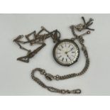 A 935 silver pocket watch with two base metal Albert chains. The watch is in as found condition,