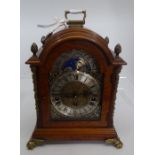 A modern 20C mantle clock with brass feet and fret work to the sides (1)