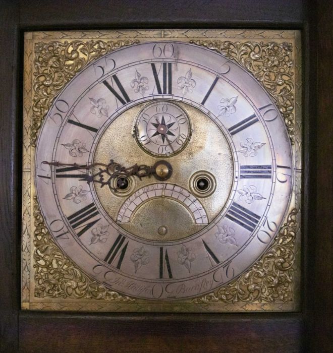 An 18th century oak longcase clock, the hood with swan neck pediments and carved wooden paterae, - Image 2 of 2