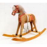 A circa 1960s child's rocking horse, possibly Austrian/German, approx 58cm high x 83cm long